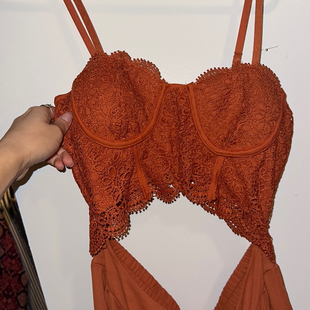 Gorgeous burnt orange colored two piece set that is attached to each other.